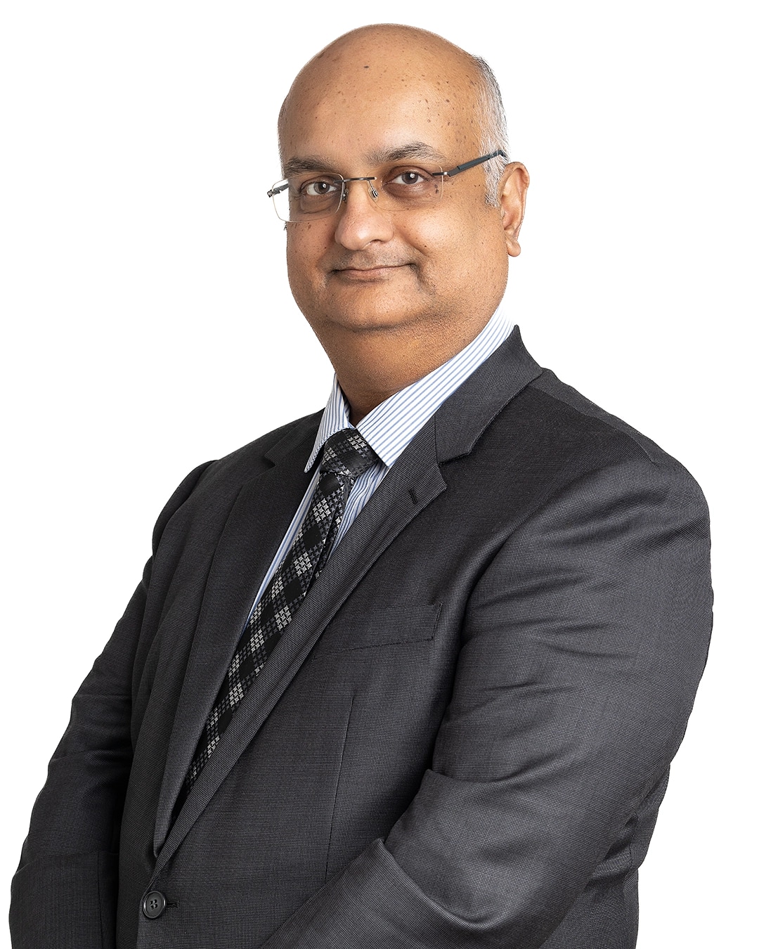 Corporate executive portrait of a man in a grey suit and tie