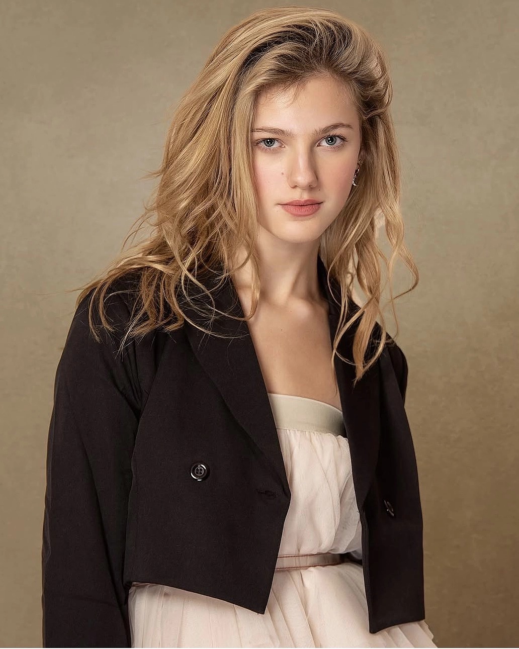 Executive portrait of a woman wearing a black blazer