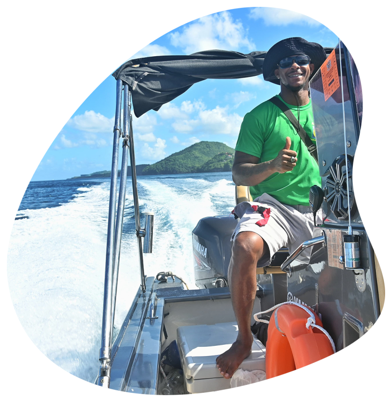 Guests enjoying a boat tour with ocean backdrop