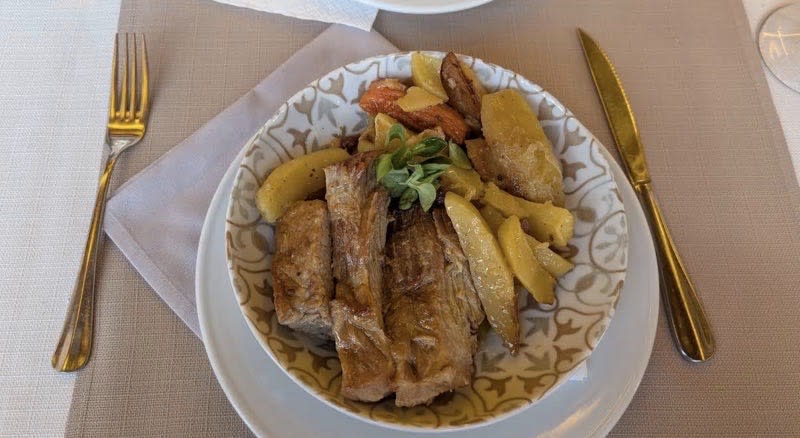 Slow-roasted pork shoulder with root vegetables