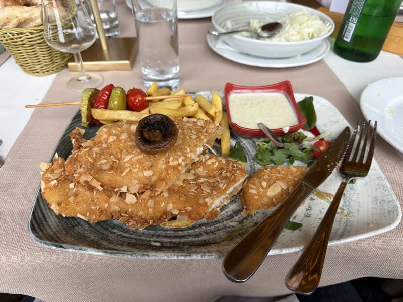 Almond-crusted chicken schnitzel with grilled vegetable skewers
