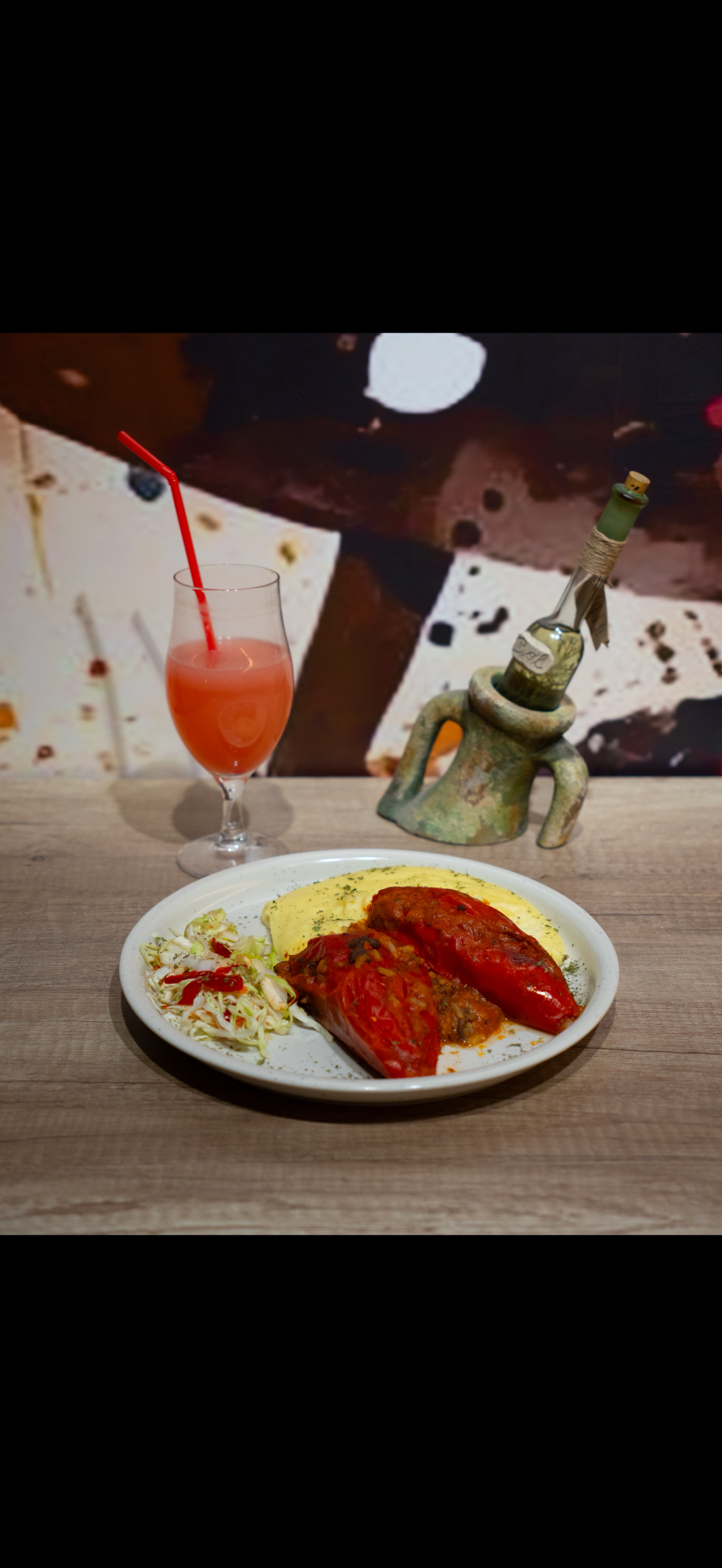 Balkan stuffed red peppers with polenta and cabbage salad