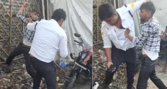 फोटो परिचय-पुलिसकर्मी की मारपीट करता युवक।
