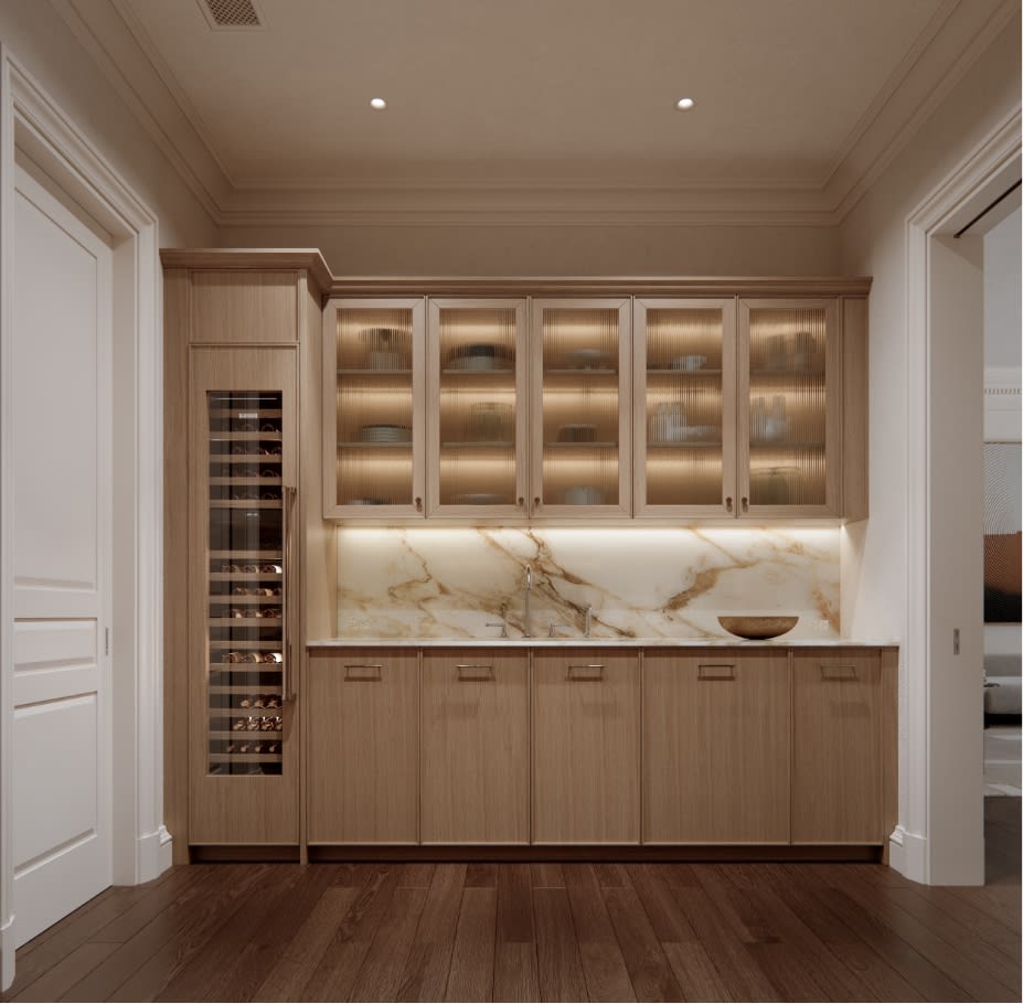 Back kitchen at The George with integrated appliances, custom millwork cabinetry in pale oak, and refined hardware details
