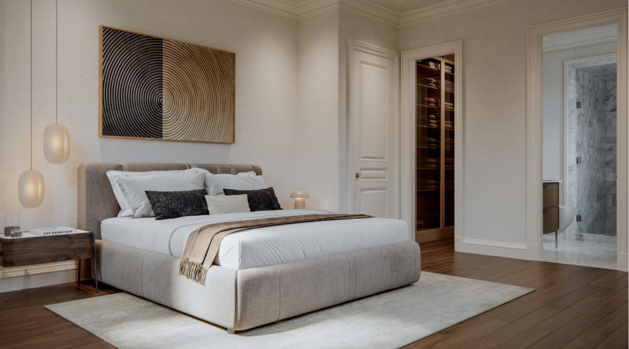 Guest bedroom at The George with neutral upholstered furnishings, warm timber accents, and a serene palette that invites rest