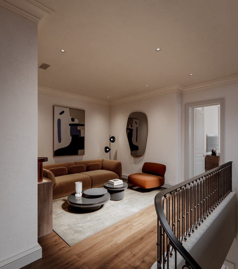 Intimate sitting room at The George with arched window, natural stone floor, bespoke upholstered seating, and carefully curated art