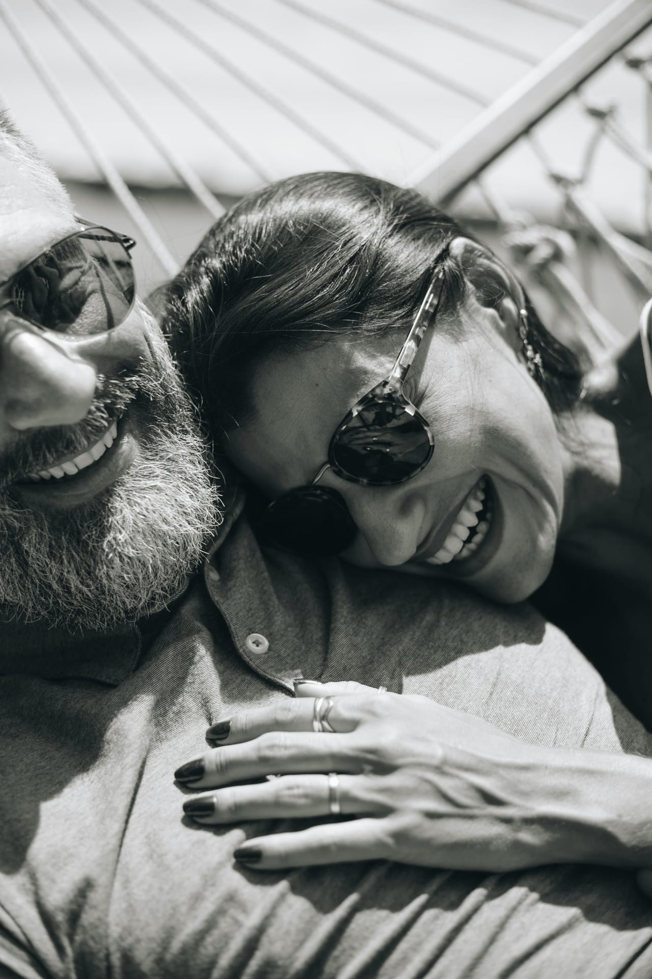 Couple enjoying indoor-outdoor living space at The George