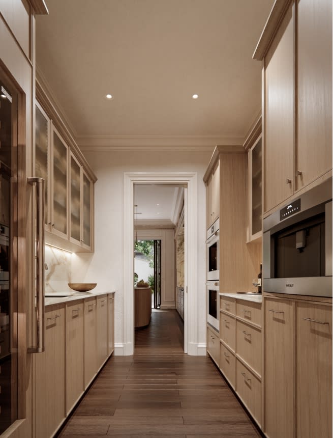 Back kitchen with integrated appliances and refined finishes