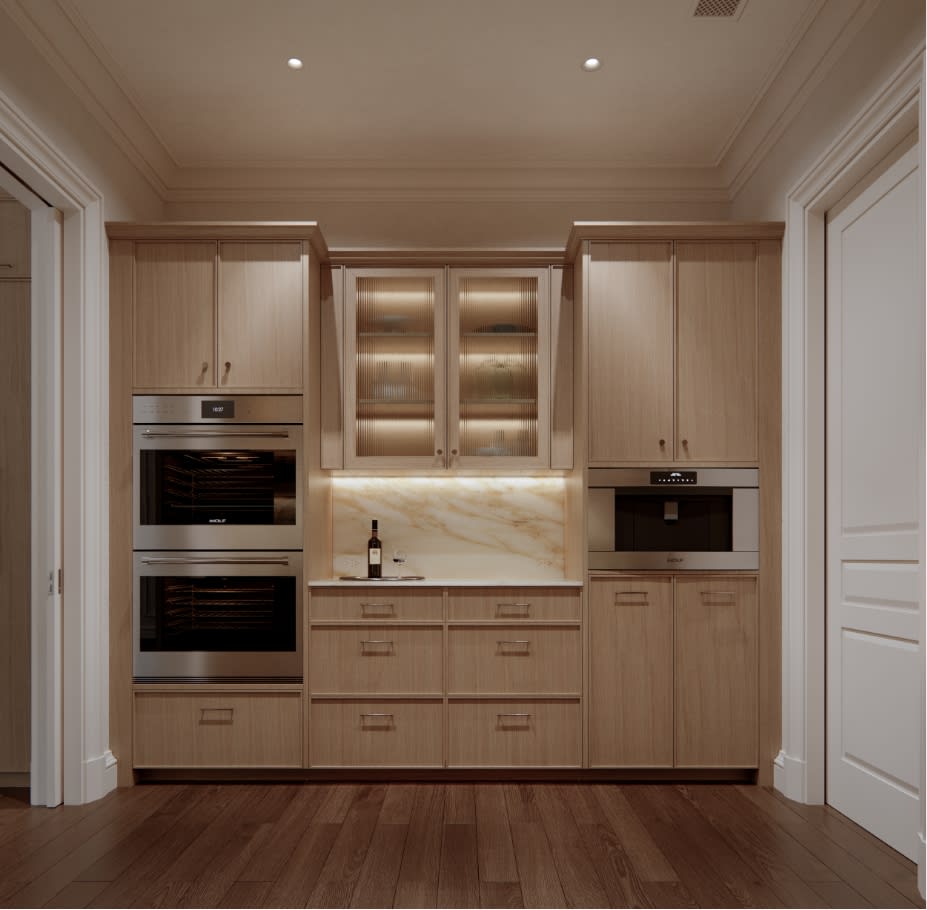 Detail of the butler's pantry at The George with custom oak cabinetry, integrated shelving, and refined brass hardware