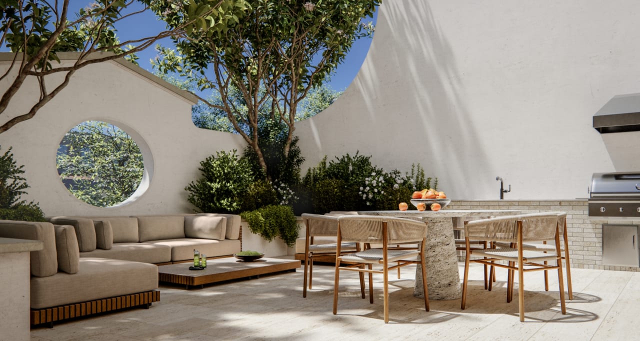 Outdoor terrace with seating, dining area, and mature trees