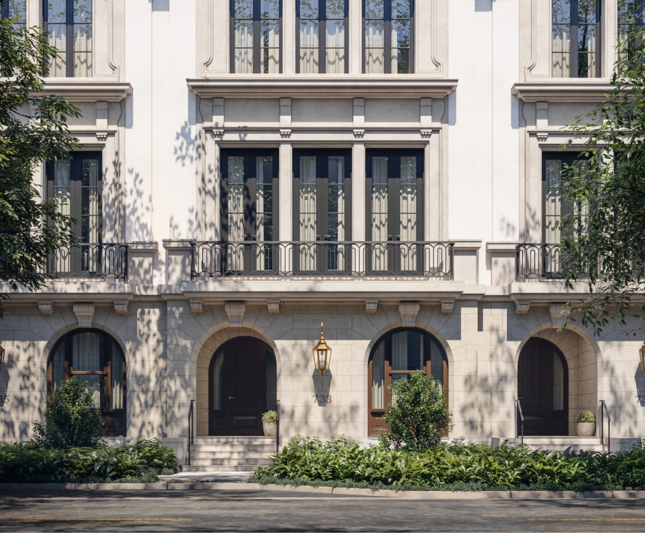 Grand limestone facade of The George, its arched windows and lush tropical landscaping evoking Coral Gables’ Mediterranean Revival heritage