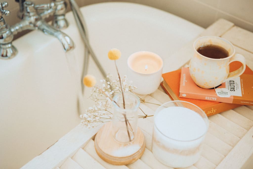 Books, coffee, candle for a nice bath