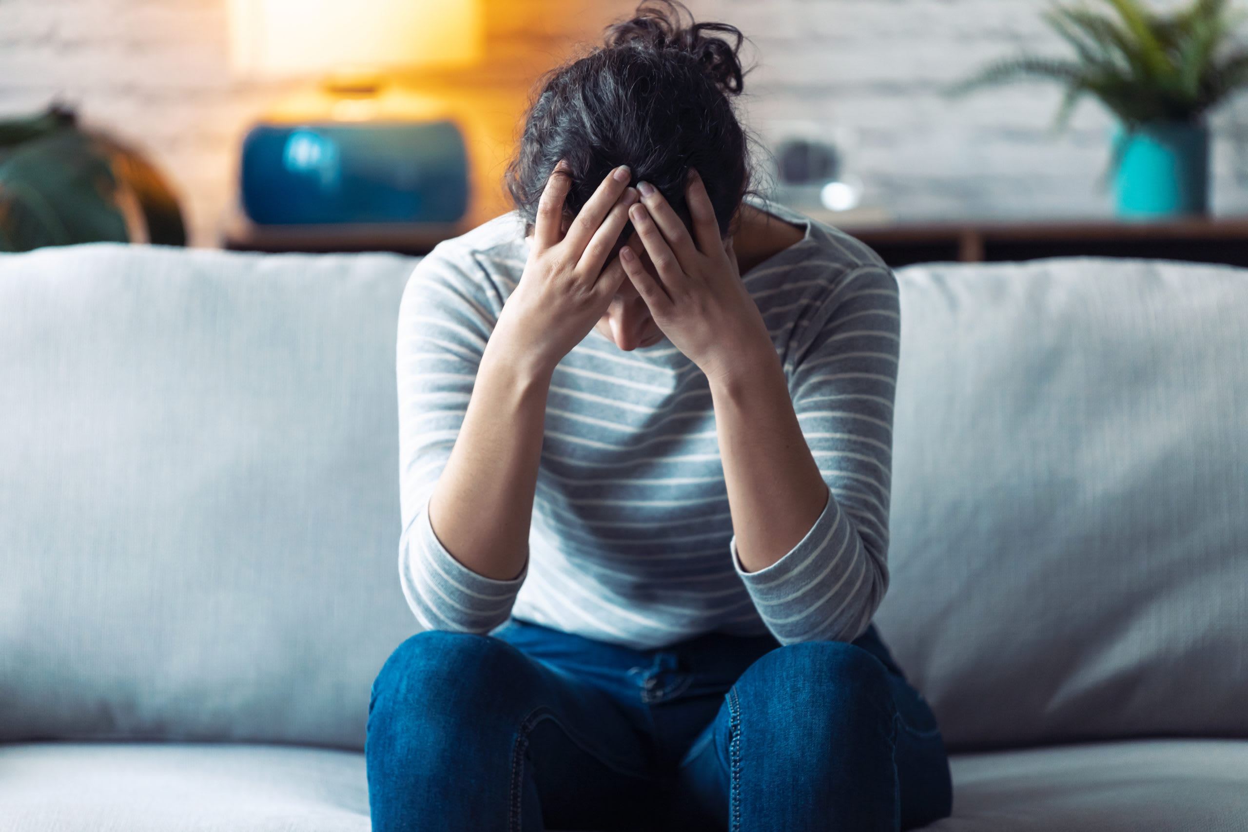 Stressed and depressed young woman thinks about her anxiety