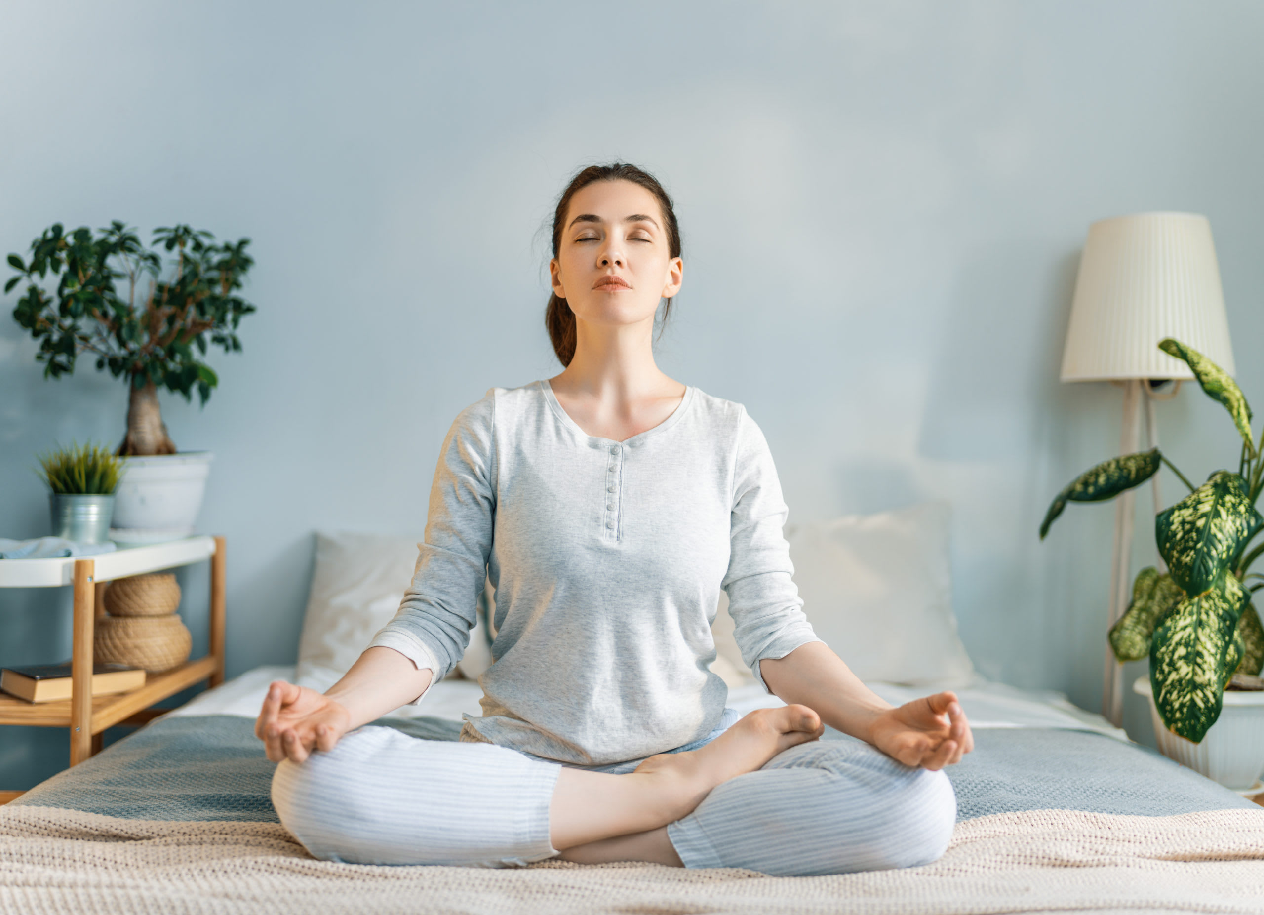 woman enjoying sunny morning and practicing meditation