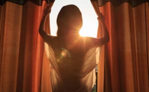 woman standing in morning day light