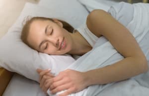 lady sleeping and smiling