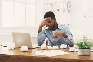 Man with Insomnia at office