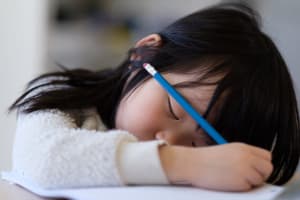 child falling asleep during school