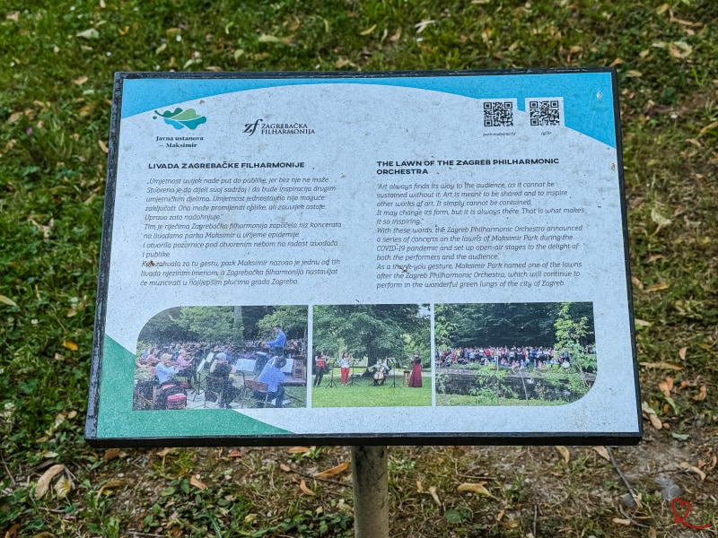 Information panel on the Zagreb Philharmonic in a park.