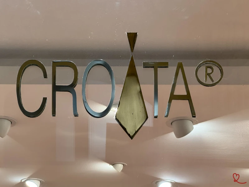 CROATA logo with a stylized tie - crossing the Octagon in Zagreb