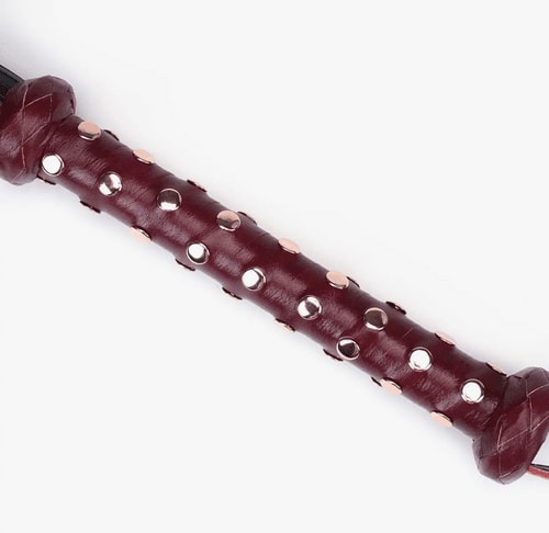 Red Leather Studded Flogger closeup of the handle