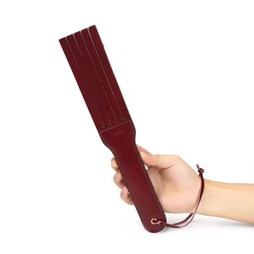 Red Leather Tawse Flogger in a hand