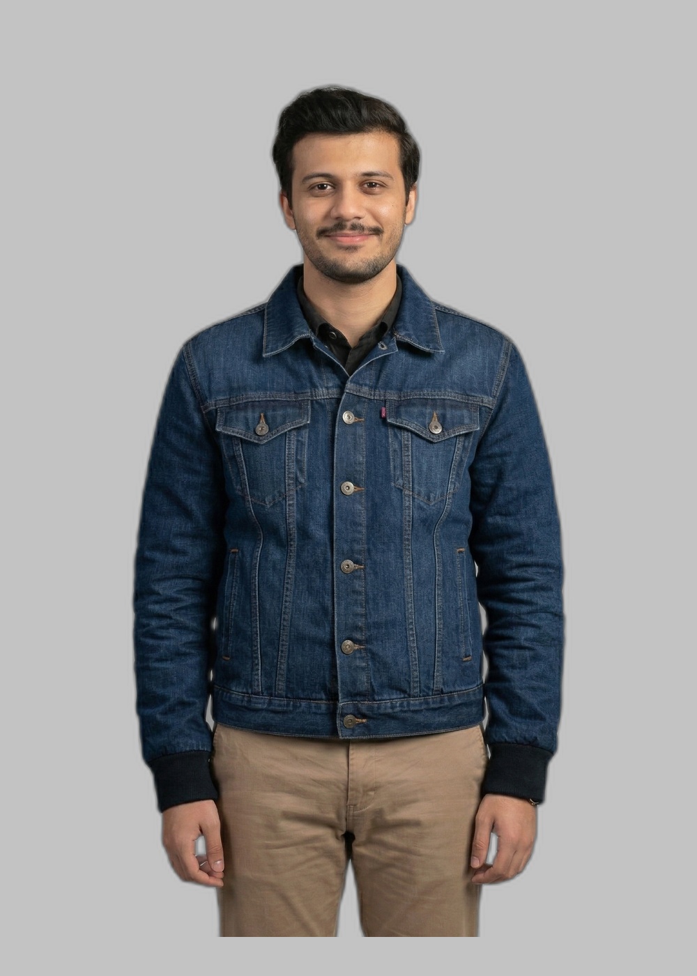 Dressia virtual try-on preview of a denim jacket layered over chinos