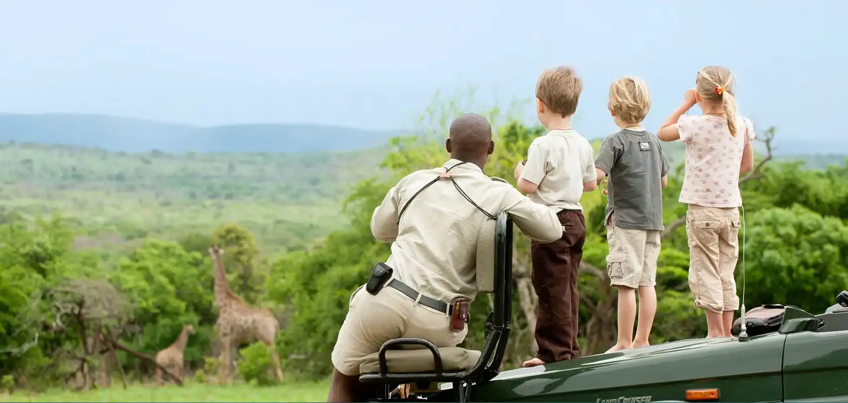 Our Tour Guide Teaching Young Lads Pronouncing Hello in Swahili