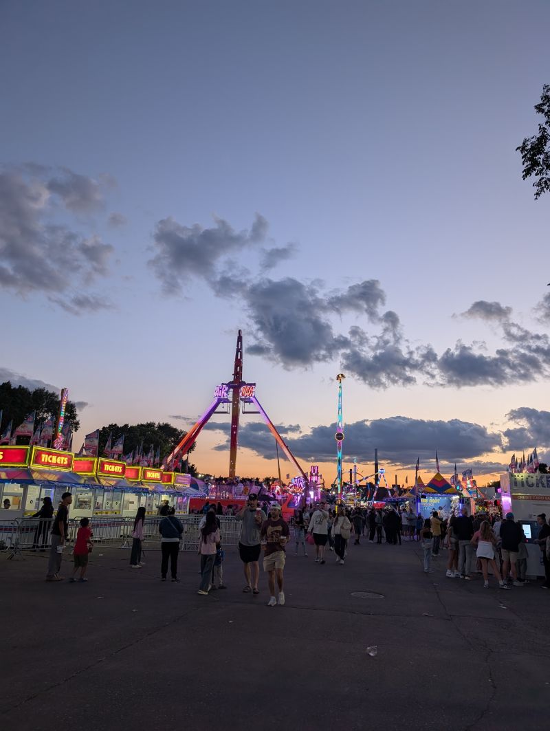 The Mighty Midway at dusk - where $50 disappears in 10 minutes