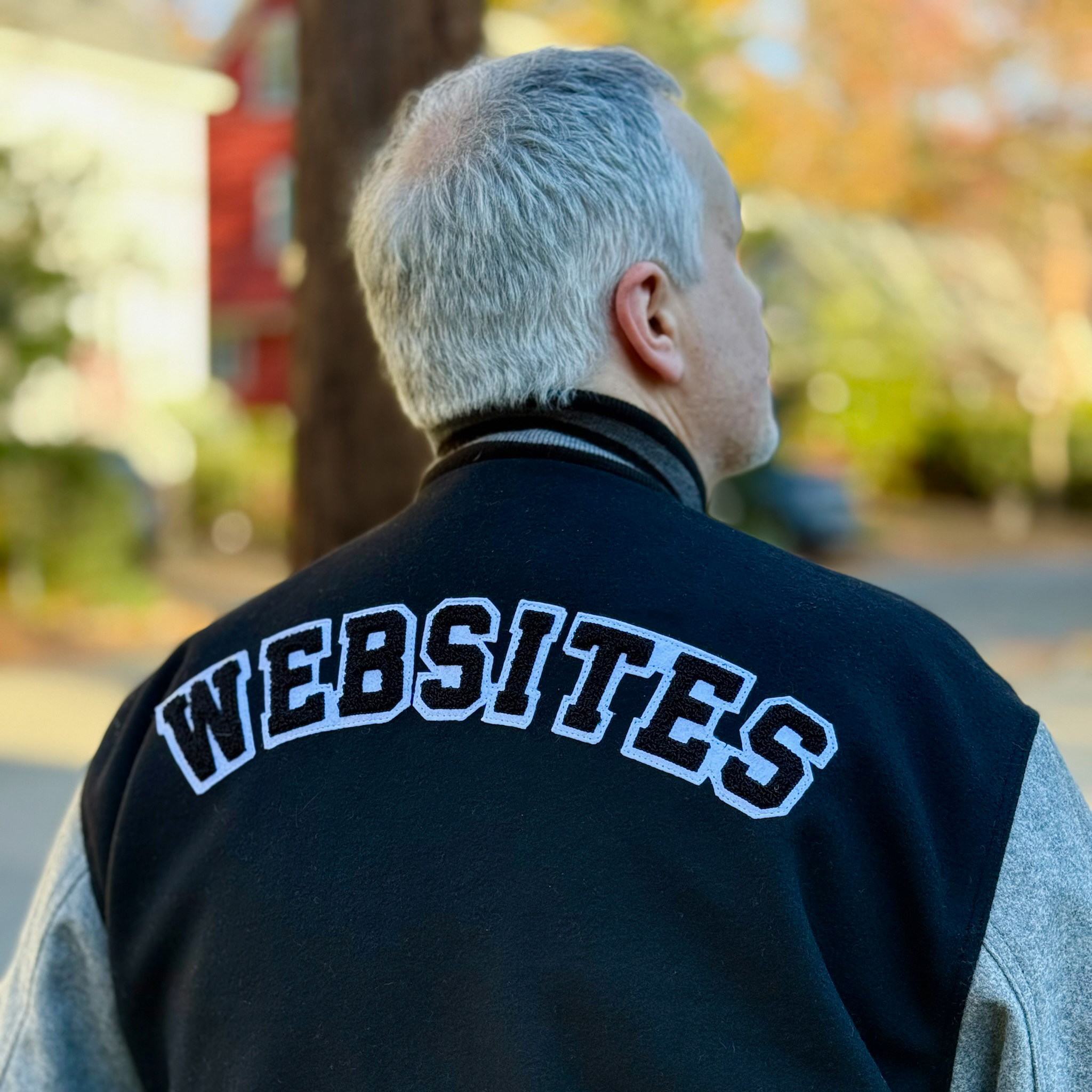 David Demaree wearing a 'Websites' jacket
