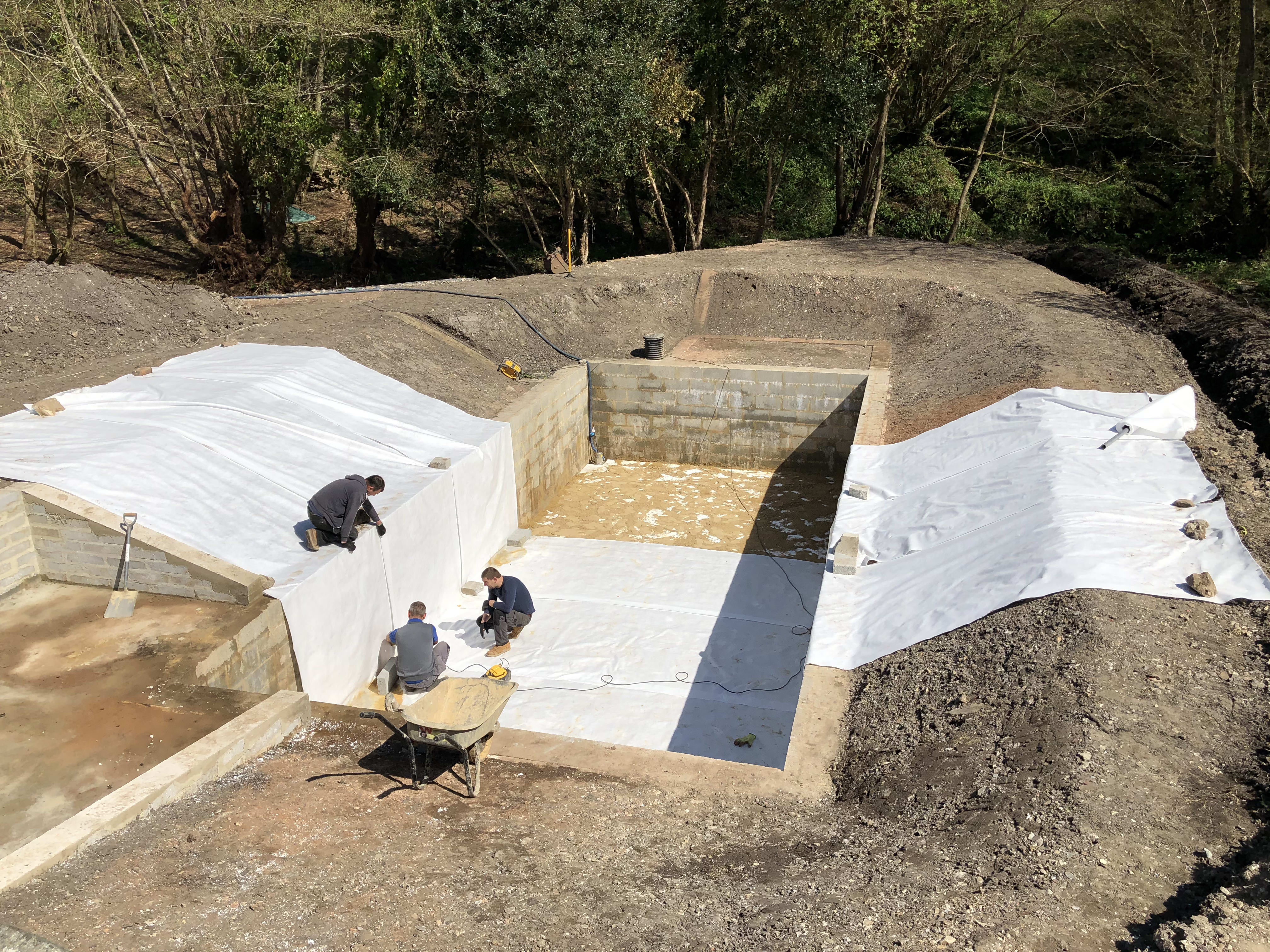 Lining the pond — building the organic swimming pond at Hole Mill, Branscombe, Devon — photo 3 of 10