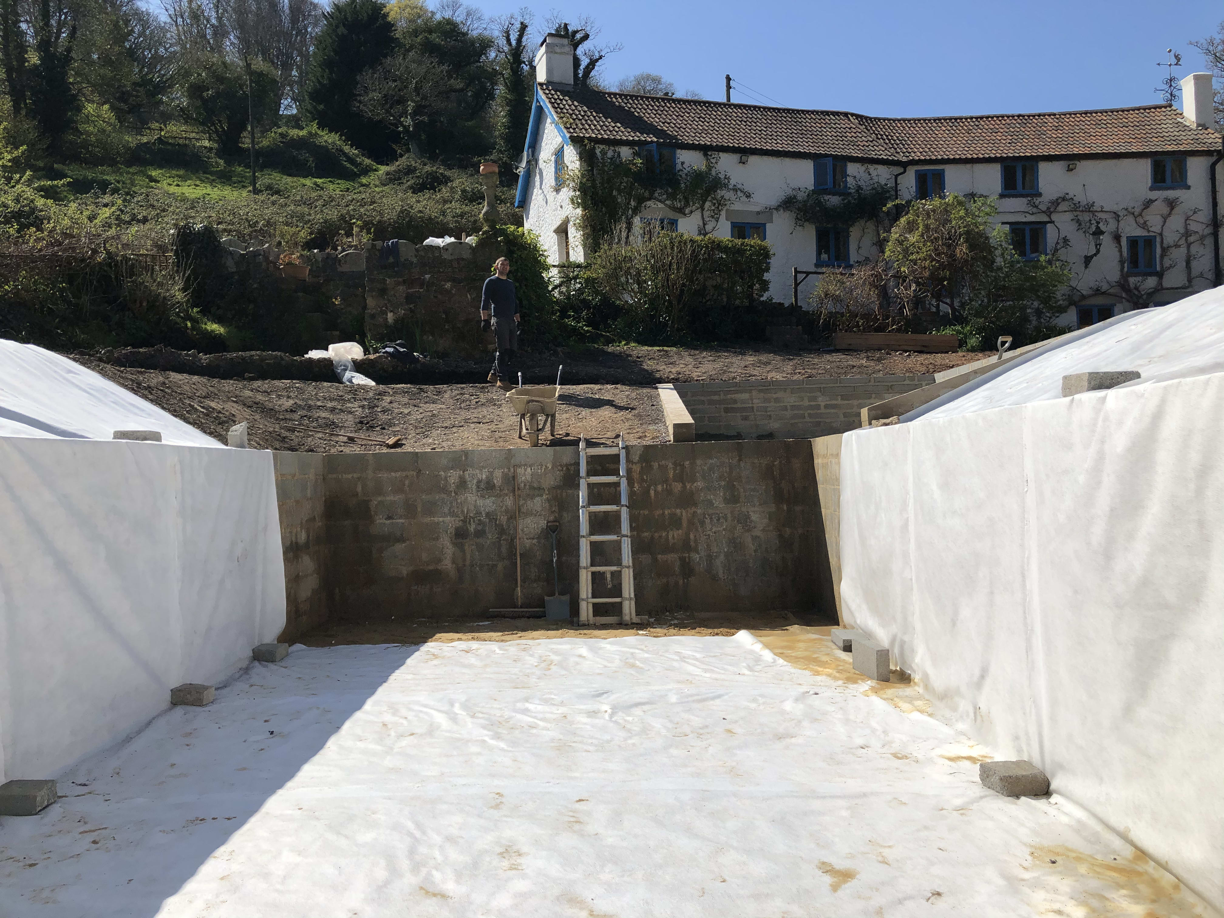 Lining the pond — building the organic swimming pond at Hole Mill, Branscombe, Devon — photo 4 of 10