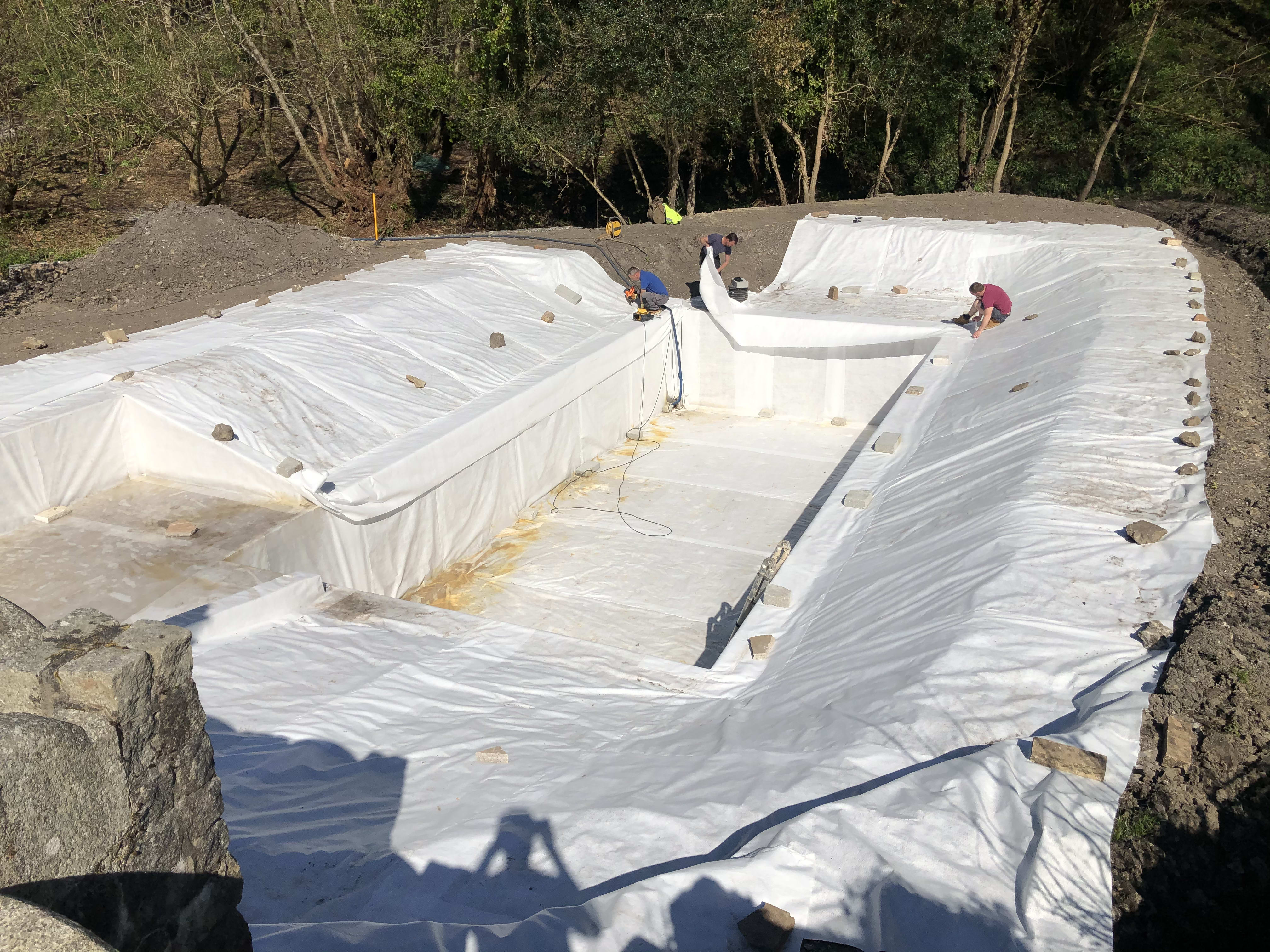 Lining the pond — building the organic swimming pond at Hole Mill, Branscombe, Devon — photo 5 of 10
