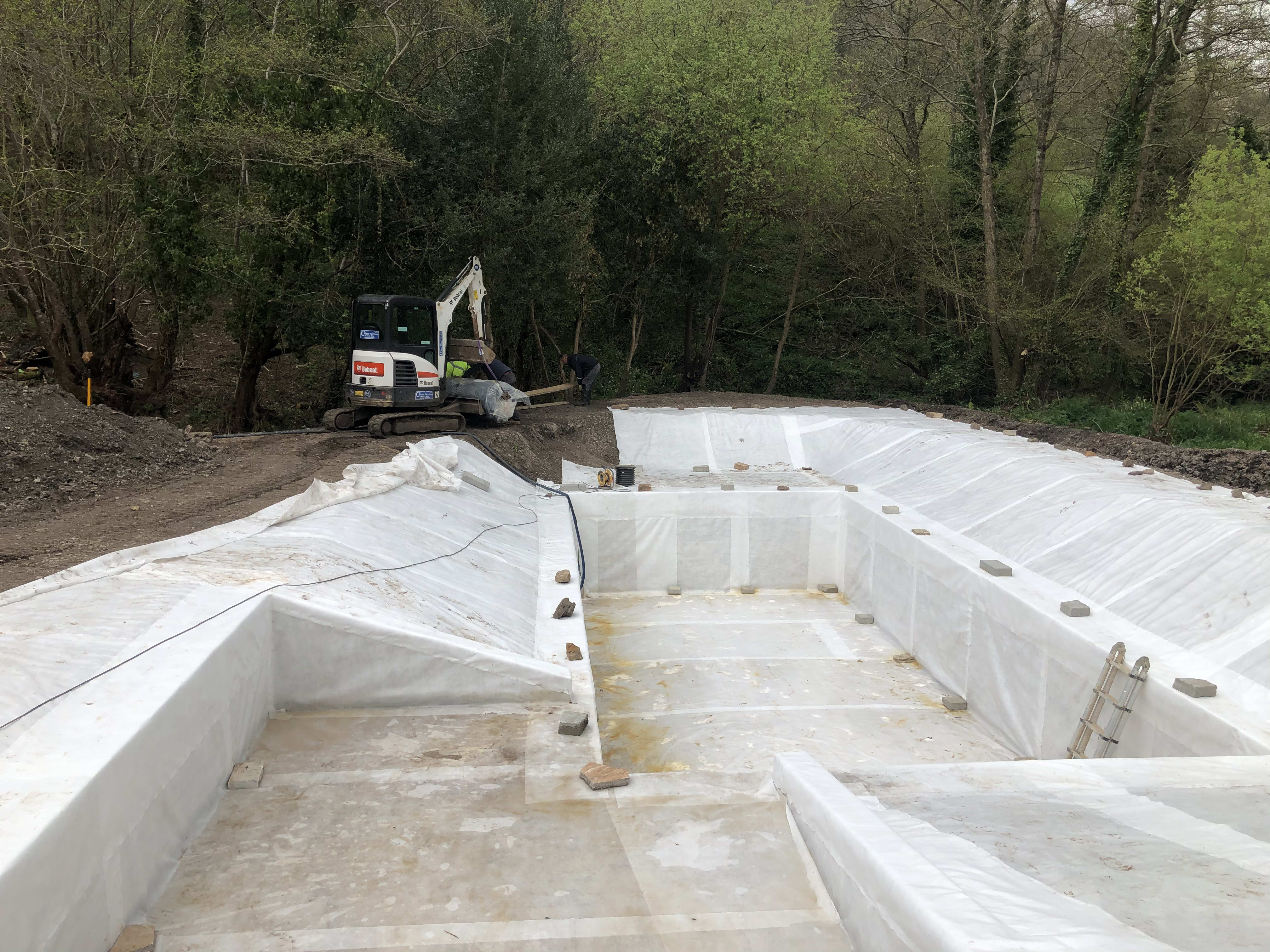 Lining the pond — building the organic swimming pond at Hole Mill, Branscombe, Devon — photo 6 of 10