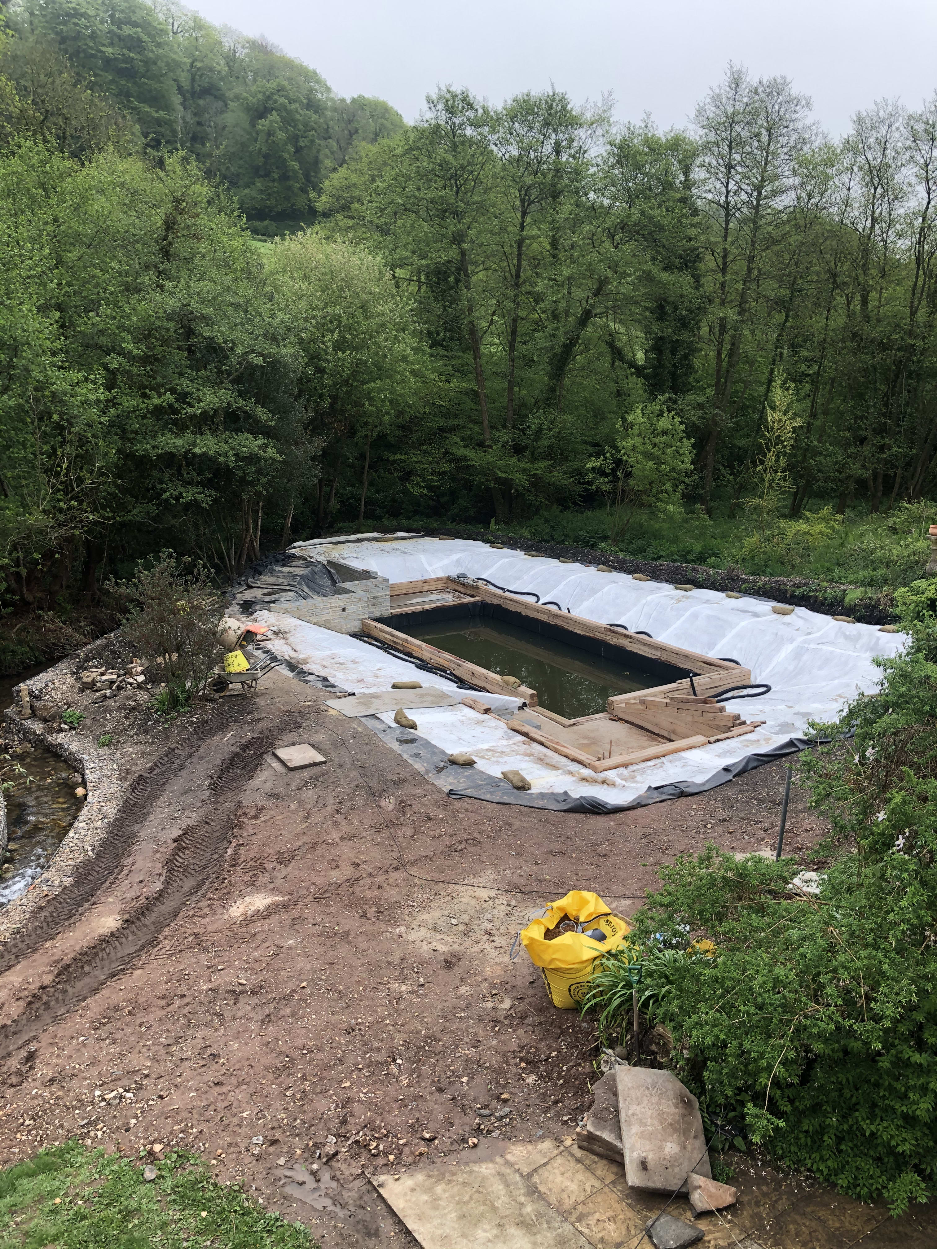 Lining the pond — building the organic swimming pond at Hole Mill, Branscombe, Devon — photo 7 of 10