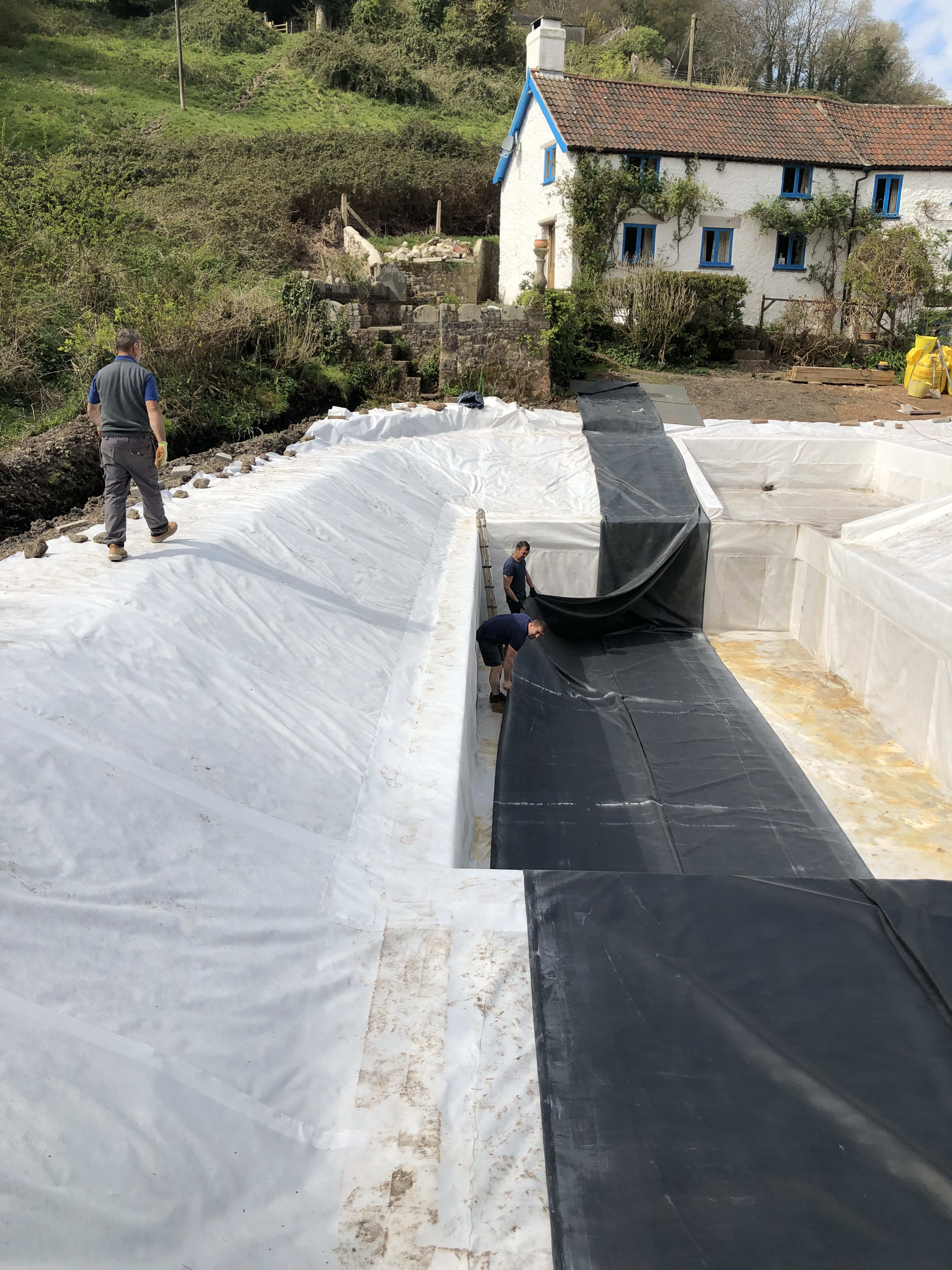Lining the pond — building the organic swimming pond at Hole Mill, Branscombe, Devon — photo 9 of 10