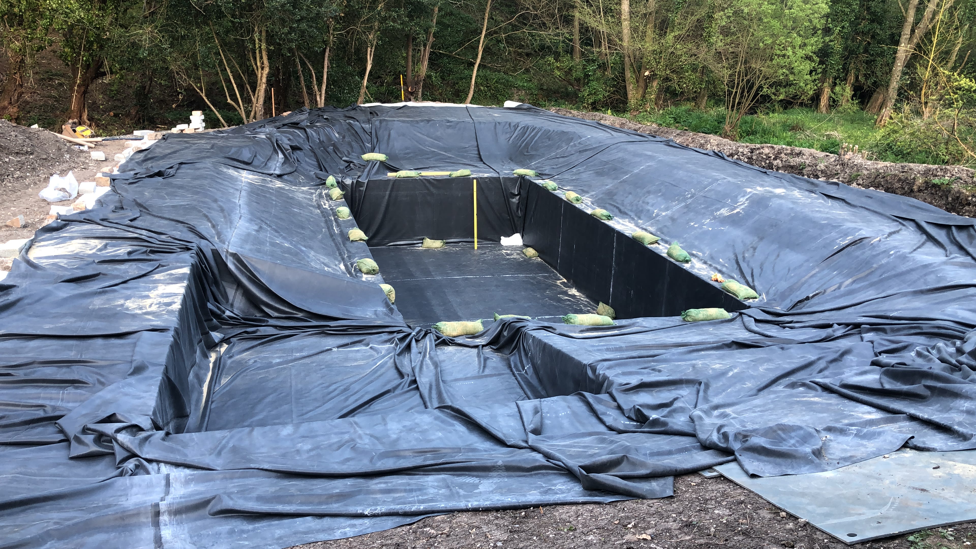 Lining the pond — building the organic swimming pond at Hole Mill, Branscombe, Devon — photo 10 of 10