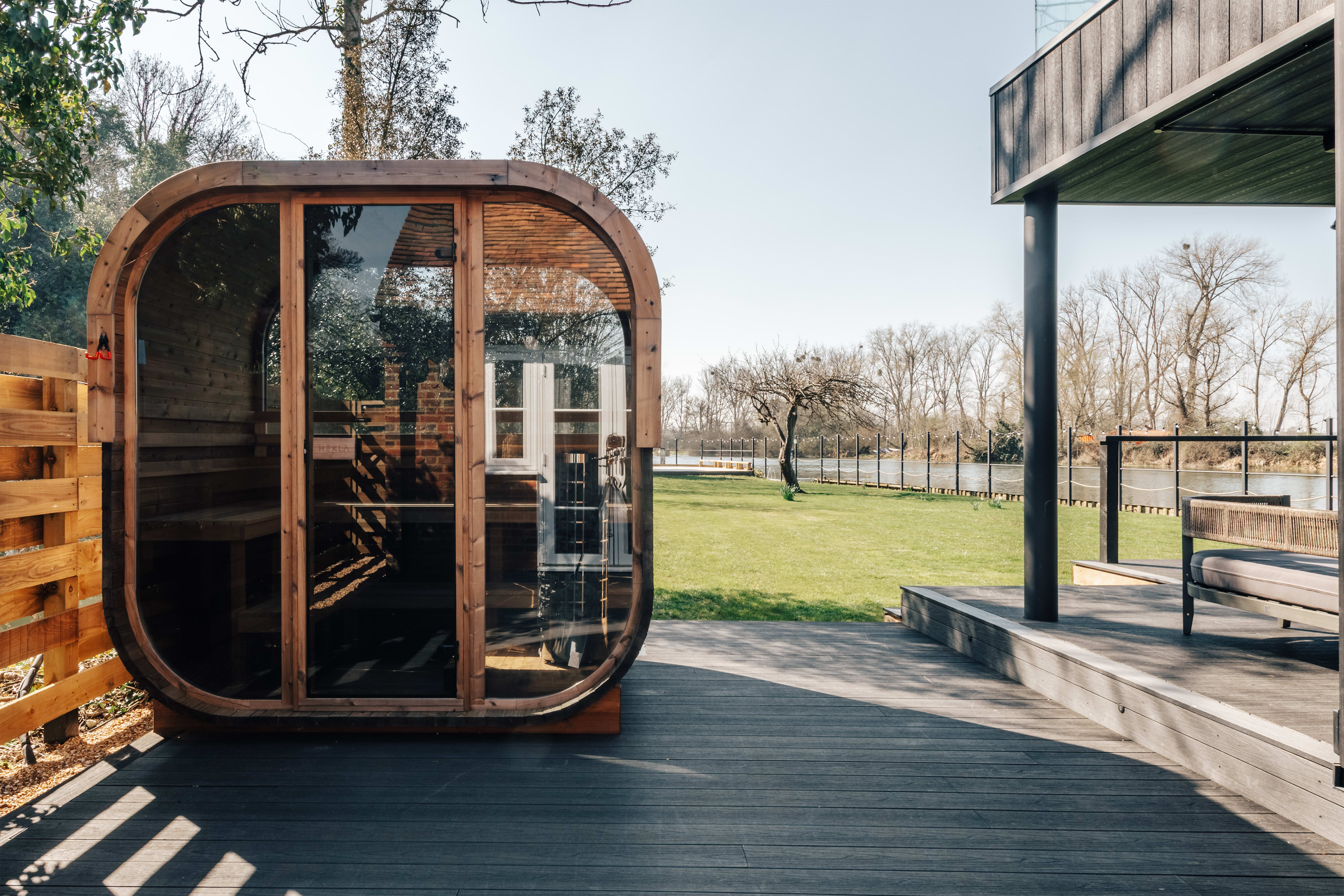 Outdoor sauna and cold shower on the decking at Weir House, Sonning