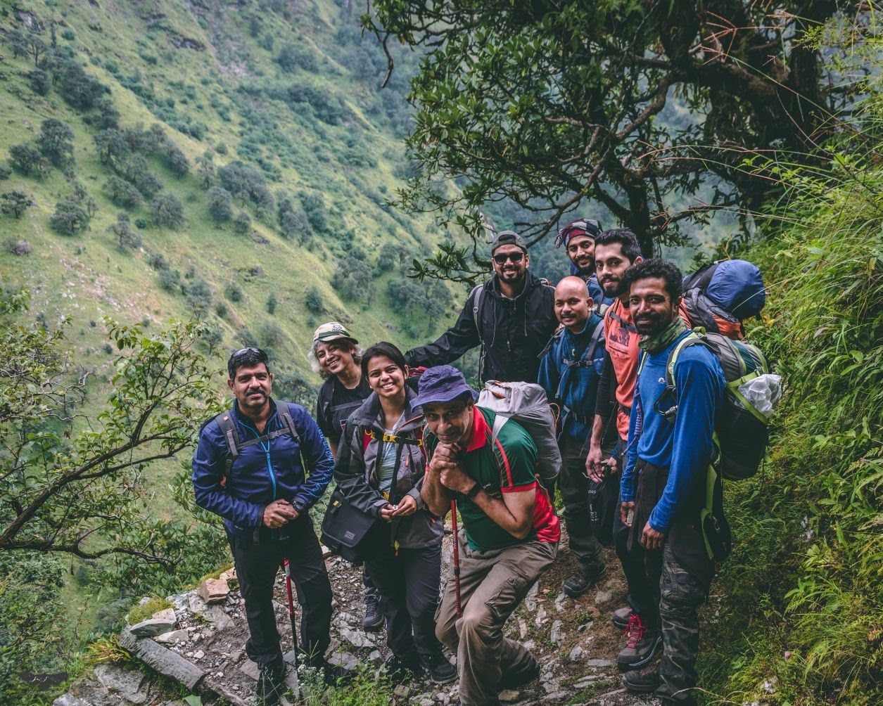 trekkers in the forest of ali bedni bugyal trek