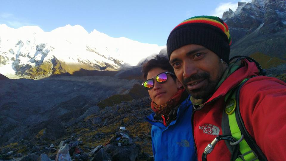 Trekkers at Goechala Viewpoint 1 facing the massive Kanchenjunga mountain range at sunrise
