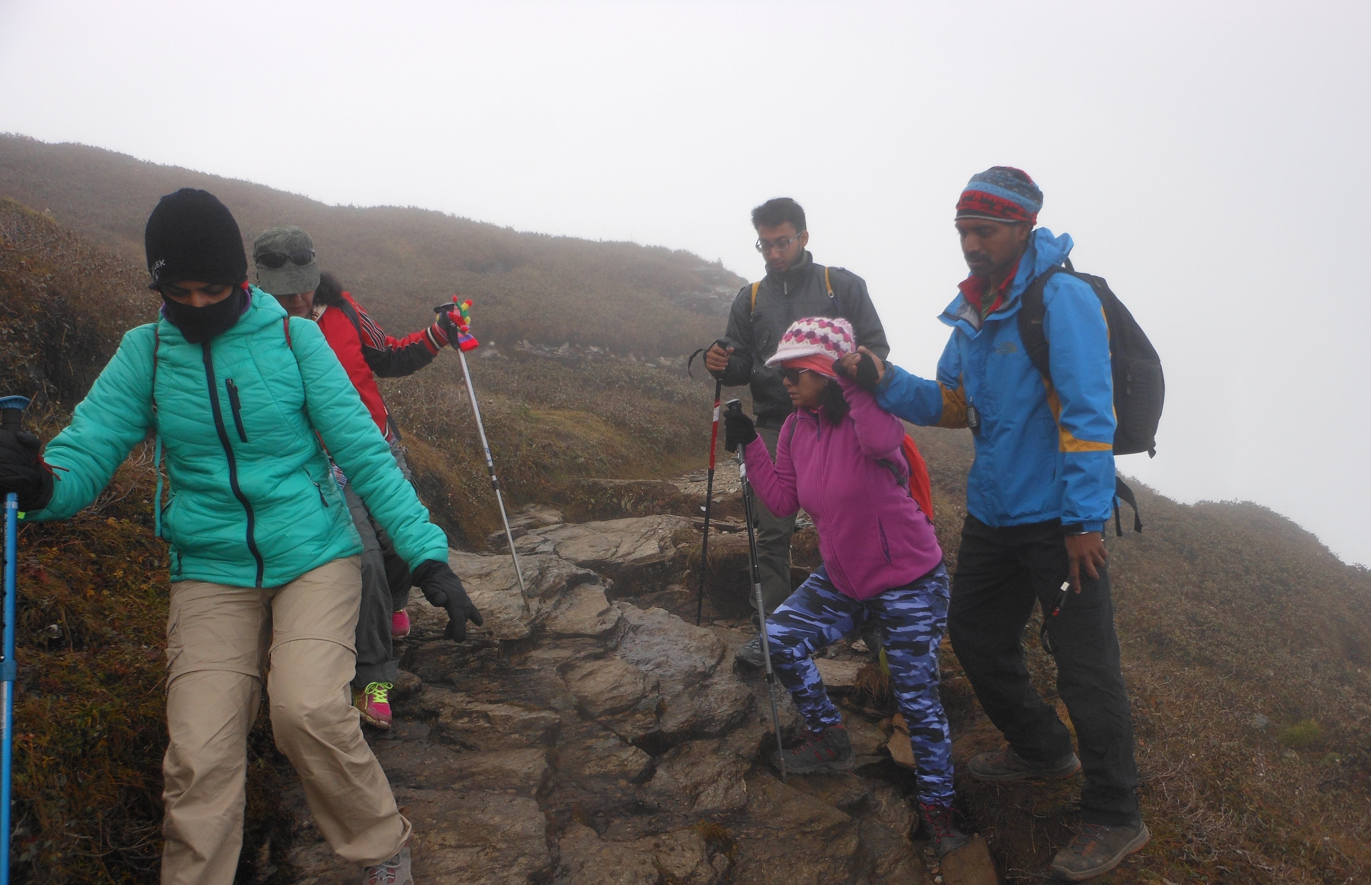 Children and families experiencing a Himalayan mountain landscape during a trek