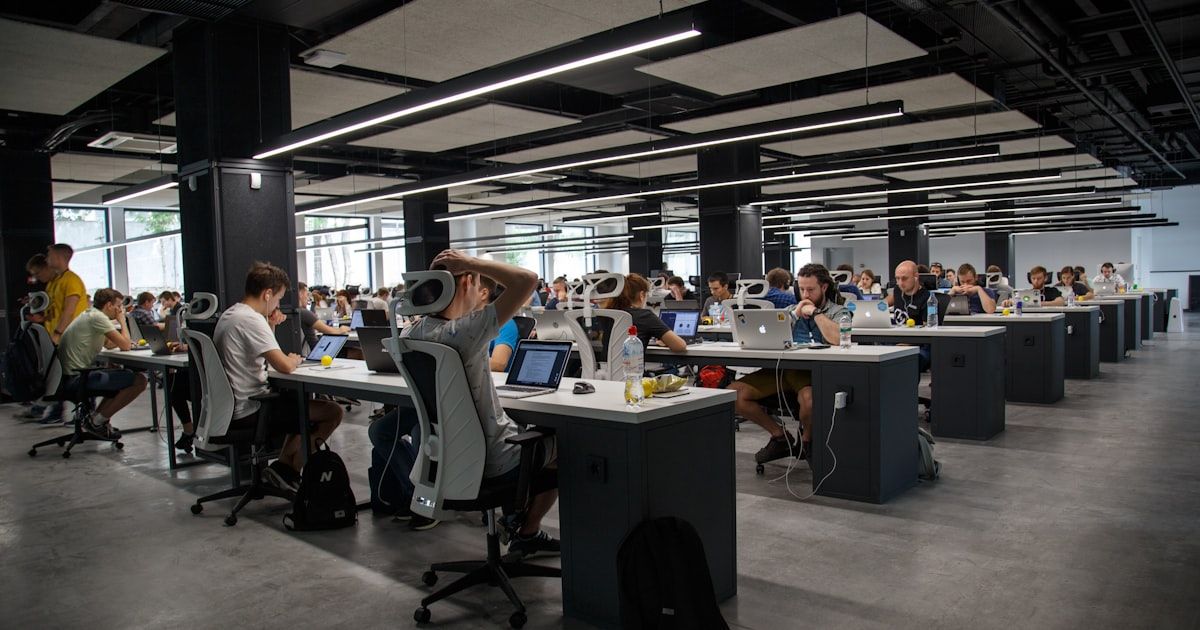 Developer working on indoor mapping integration with code on screen