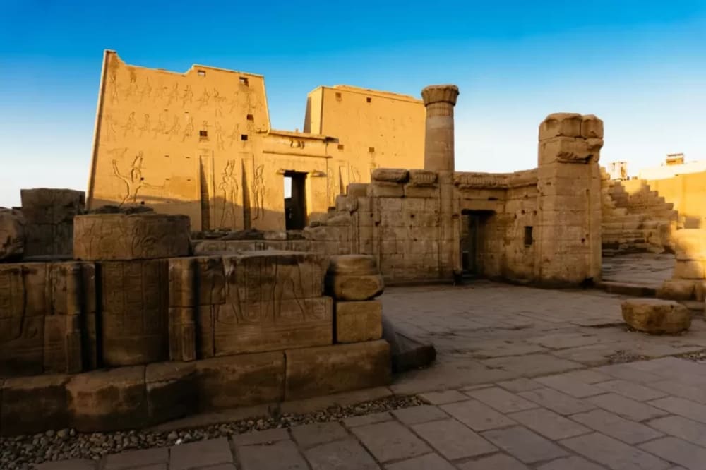 Edfu Temple and statue of Horus seen during Esplanade Nile Cruise excursion
