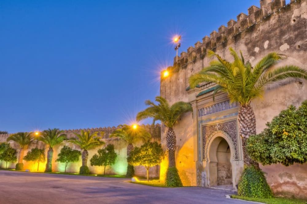 Marvel at the grand gate of Meknes on your Morocco adventure tour