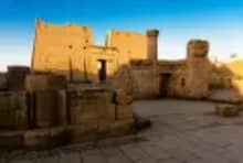 Edfu Temple and statue of Horus seen during Esplanade Nile Cruise excursion