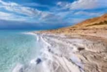 Floating in the Dead Sea featured in the 23 Days Middle East Travel Package: Morocco, Egypt, Jordan, and Dubai.