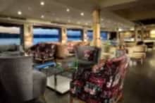 Luxurious cabin aboard MS Acamar Nile Cruise – plush bedding and panoramic window with Nile views