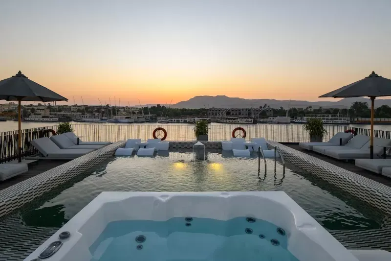 Soleil Nile Cruise sun deck with seating and view of tranquil Nile waters