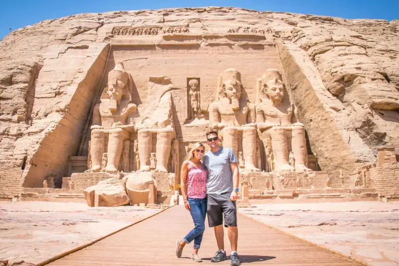 Travelers visiting the historic Abu Simbel Temple near Aswan, Egypt
