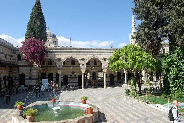 Streets of Old Damascus with traditional souks, historic buildings, and vibrant local life.